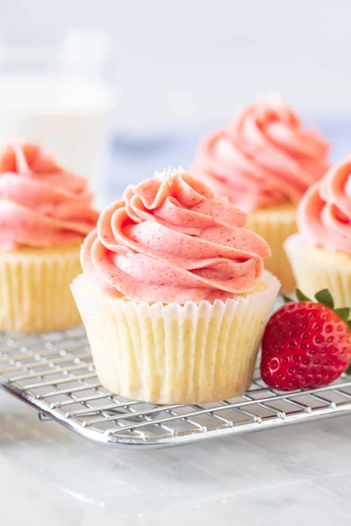 Delicious Pink Cupcakes with Sprinkles Wallpaper