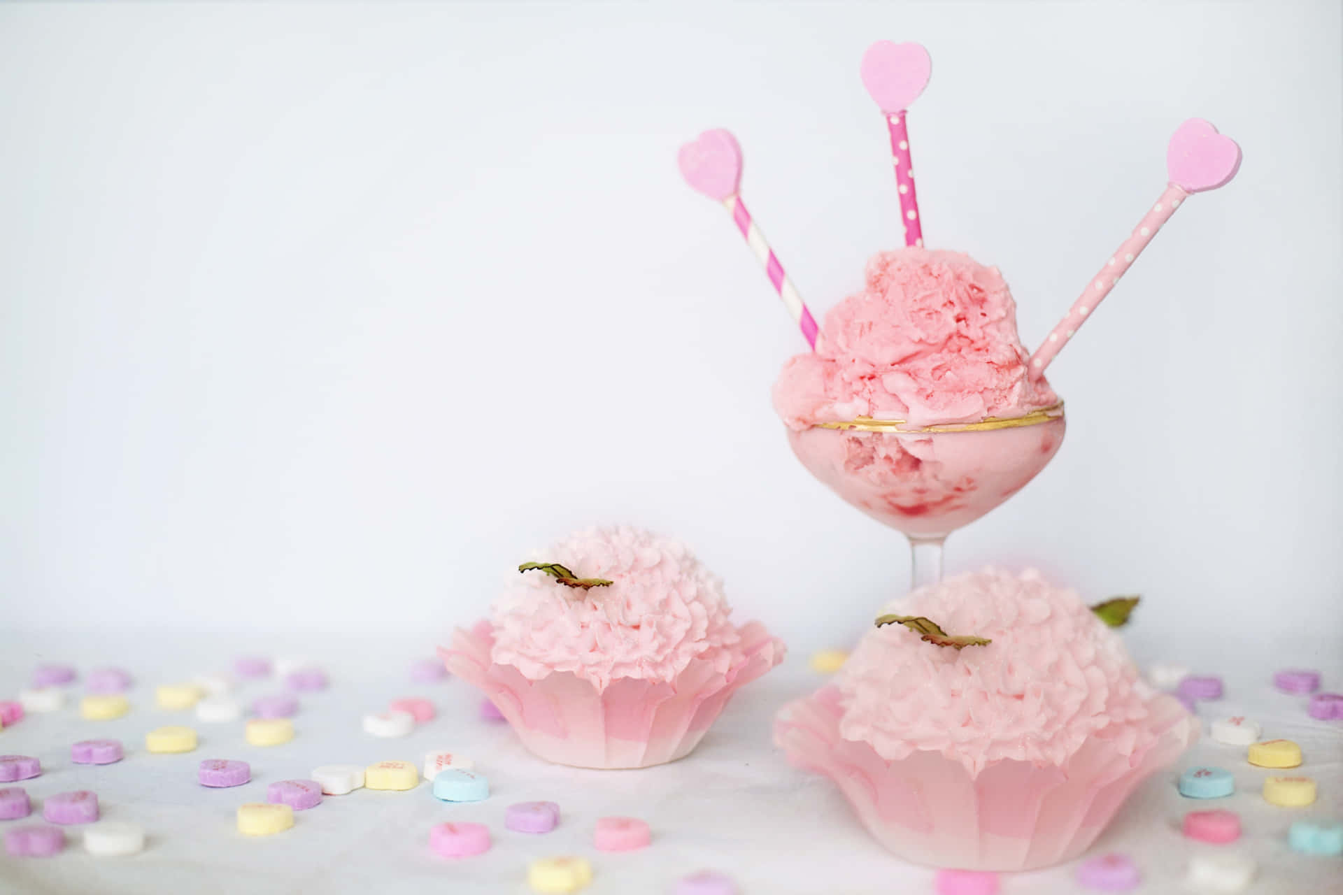 Delicious Pink Cupcakes on Display Wallpaper