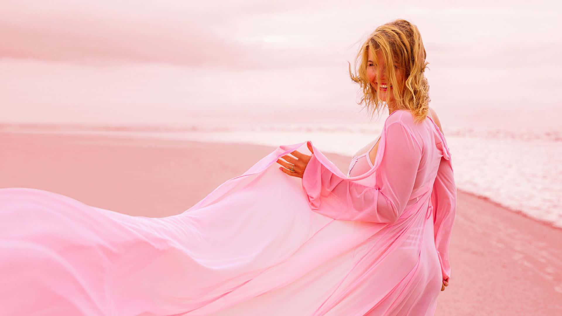 Elegant Woman in Stunning Pink Dress Wallpaper