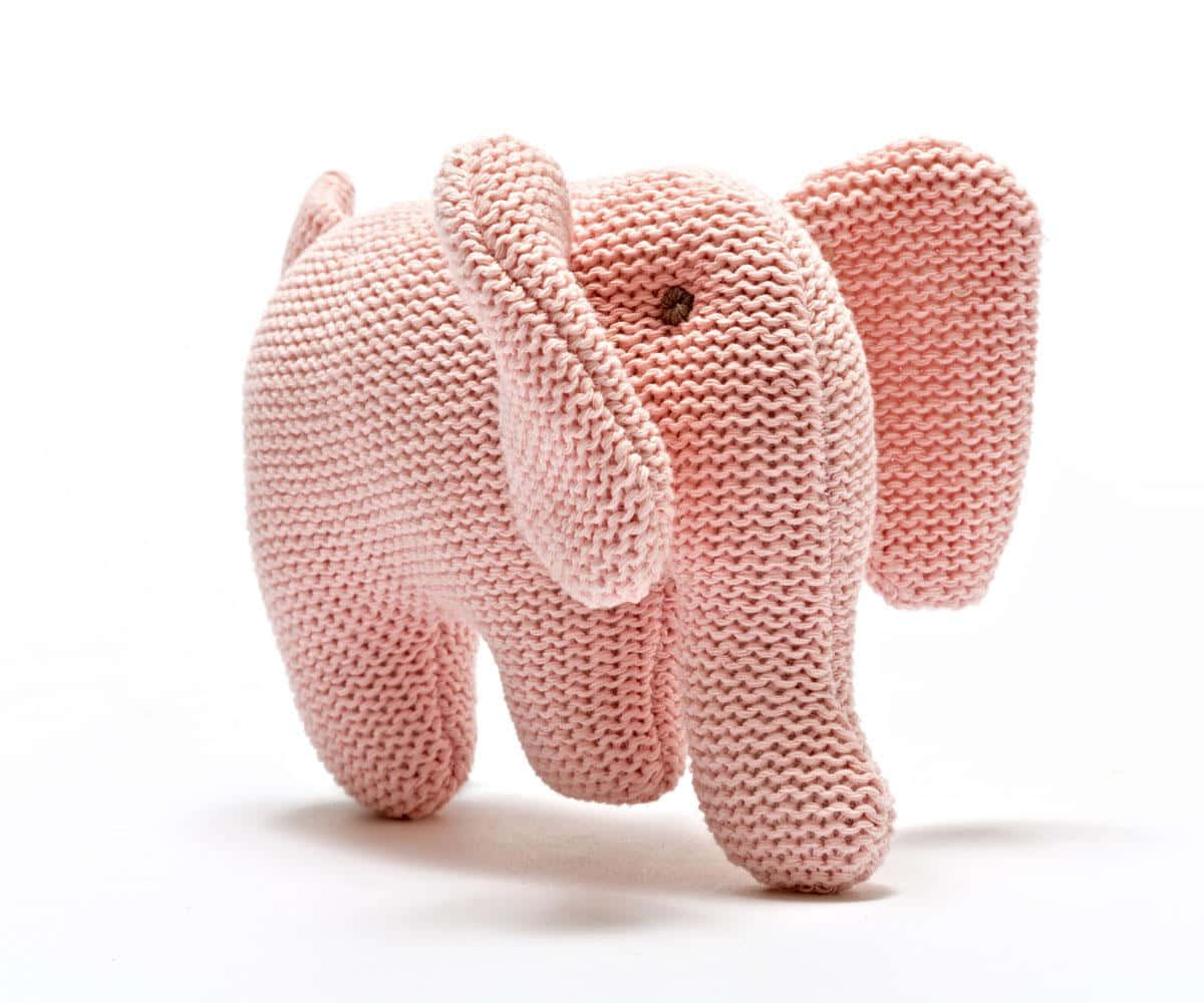 A vibrant pink elephant struts its stuff Wallpaper