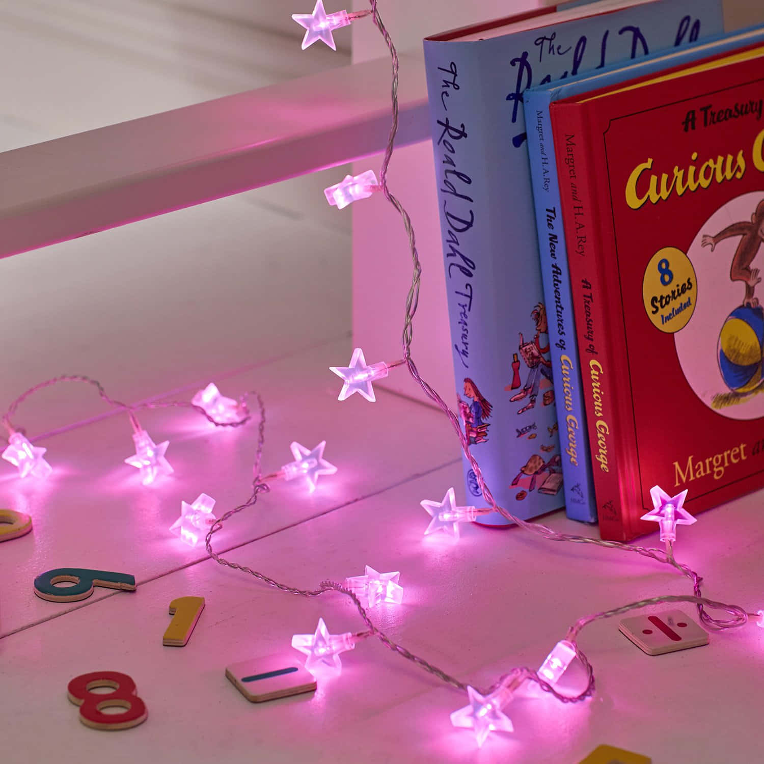 Pink Star Lights With Numbers And Books Wallpaper