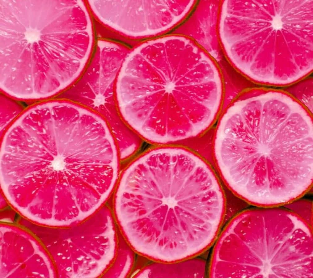 Sliced Pink Grapefruit on a Table Wallpaper