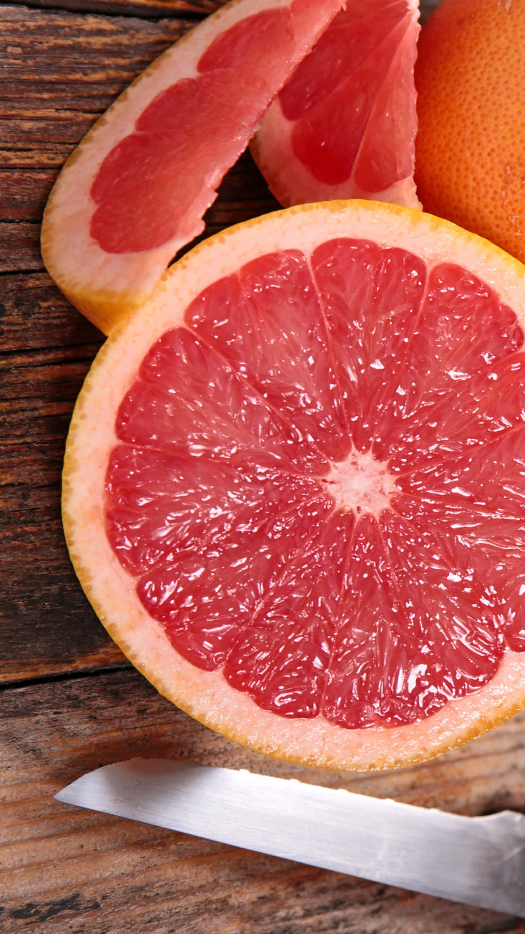 Refreshing Pink Grapefruit Slices Wallpaper