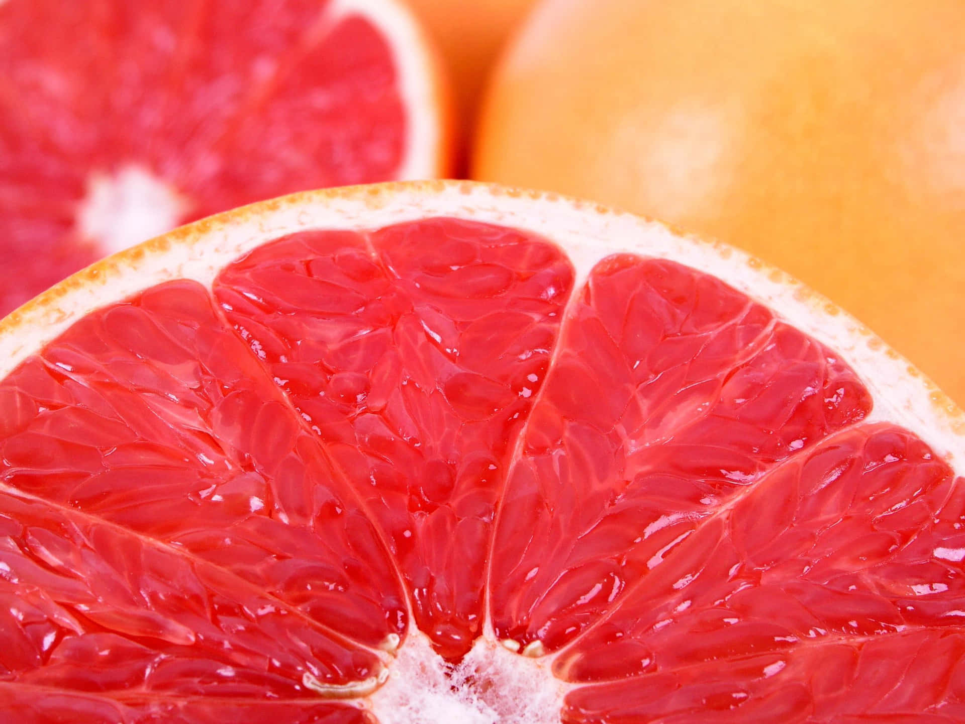 Fresh Pink Grapefruit Slices Wallpaper
