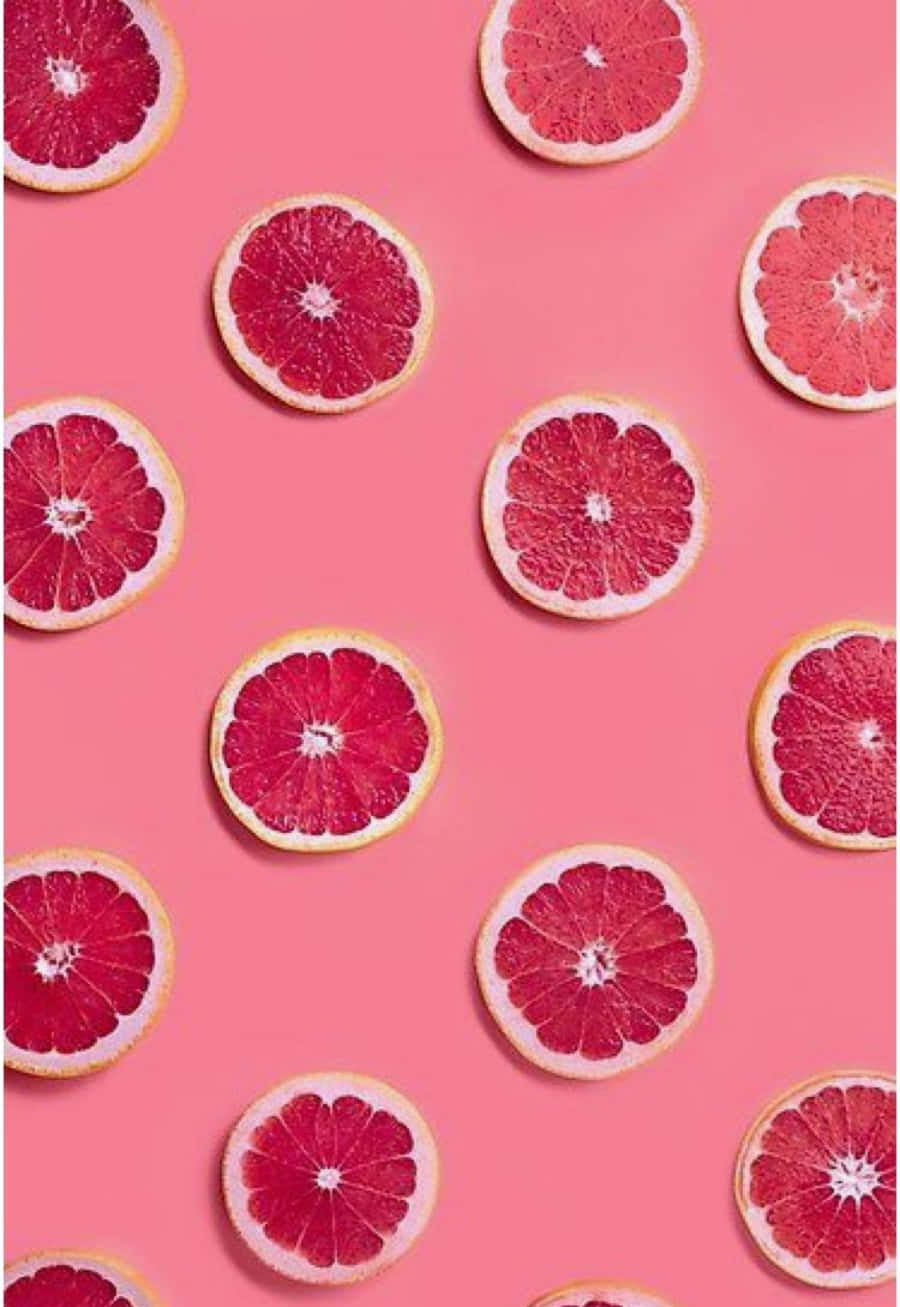 Freshly Sliced Pink Grapefruit Wallpaper