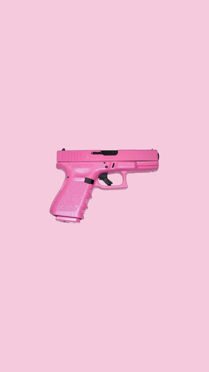 Pink Handgun Against Matching Background Wallpaper