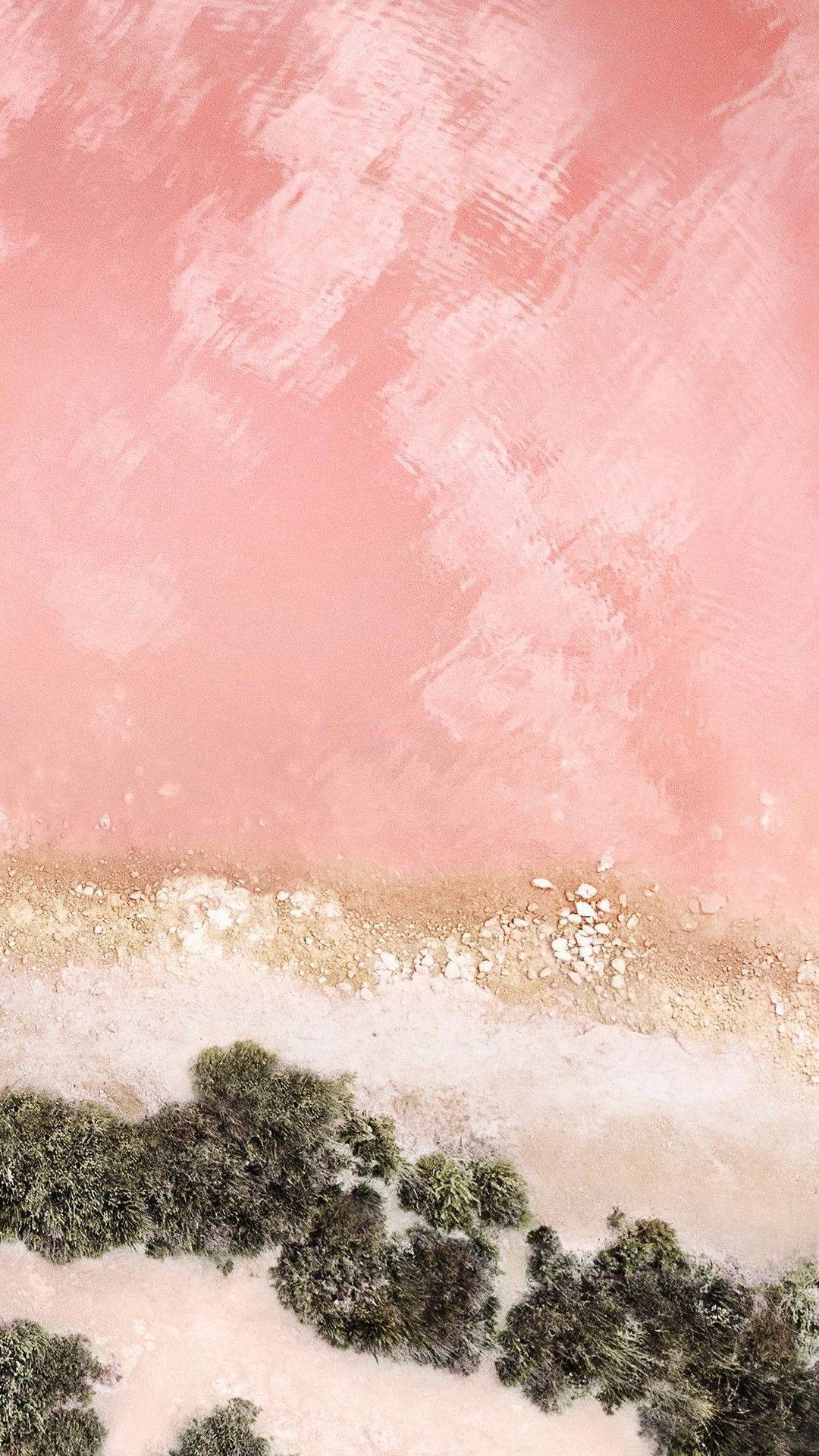 En pink sø med mange sten og træer. Wallpaper
