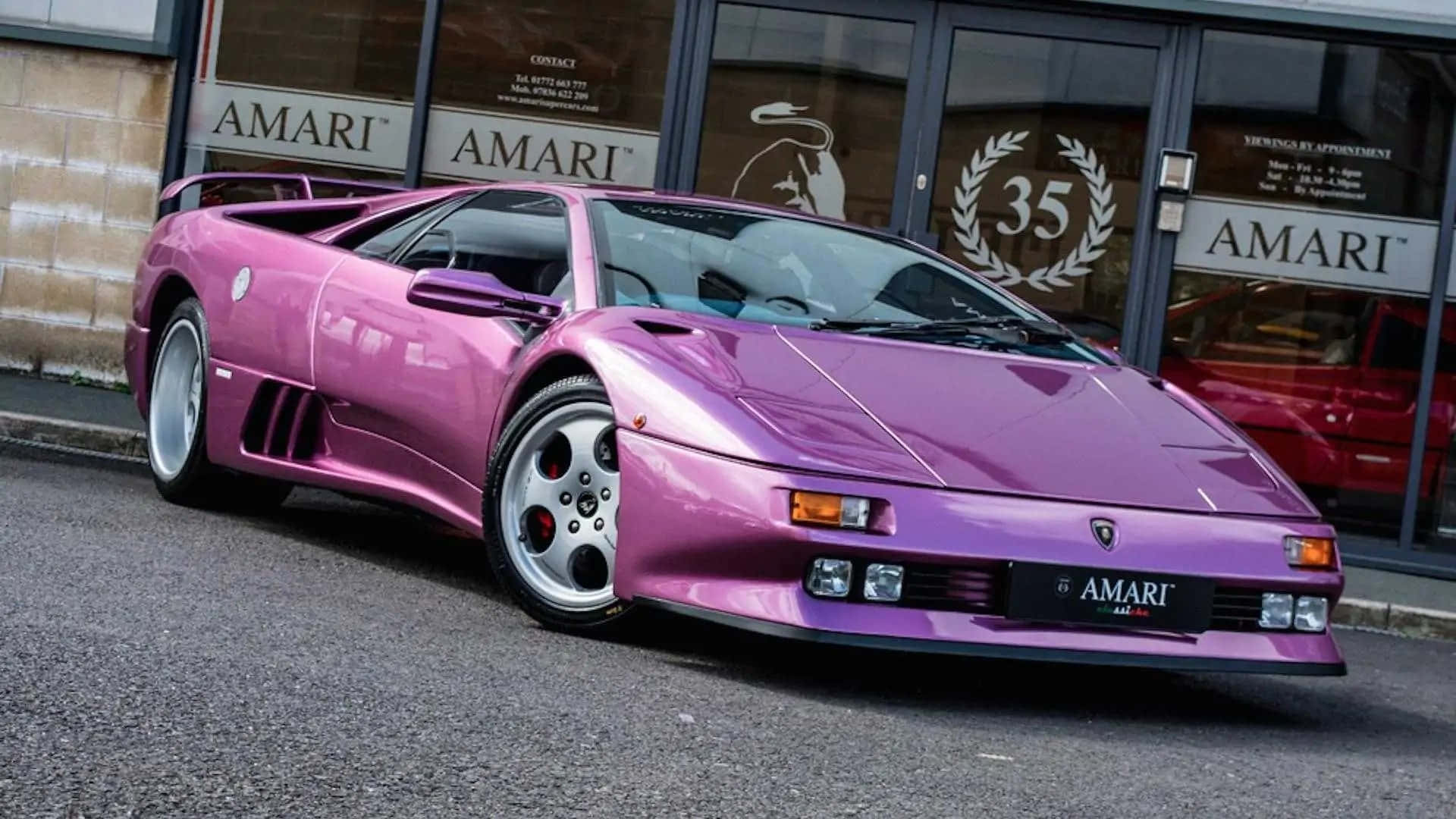 Pink Lamborghini Diablo Outside Dealership Wallpaper