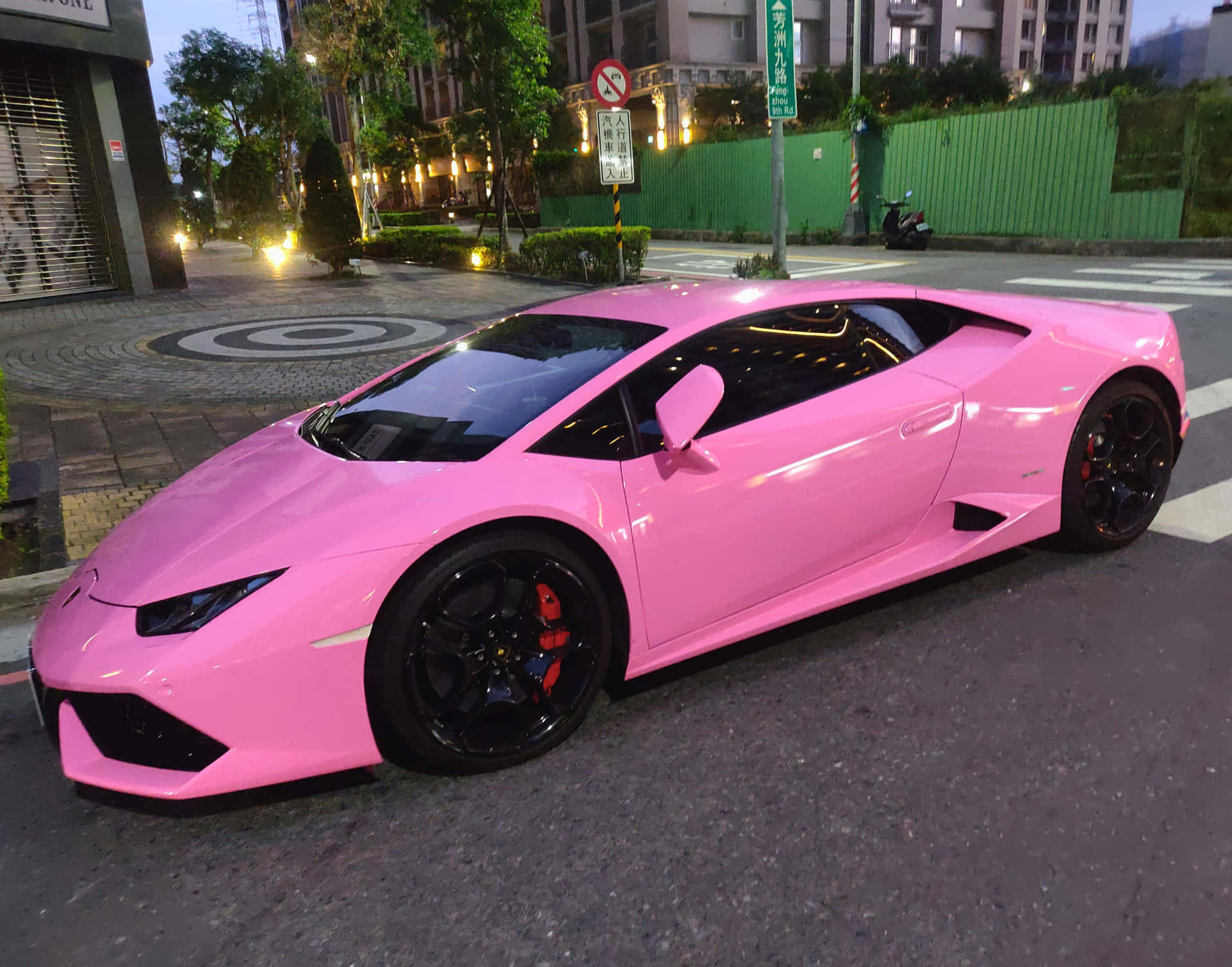 Pink Lamborghini Urban Setting Wallpaper