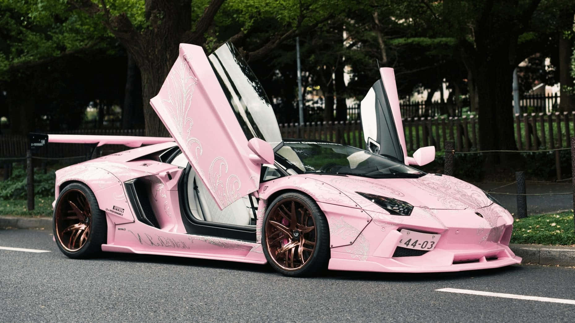 Pink Lamborghini With Doors Open Wallpaper