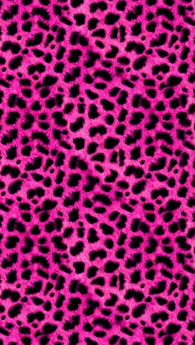 A vibrant pink and black leopard print in a classic animal-inspired pattern. Wallpaper