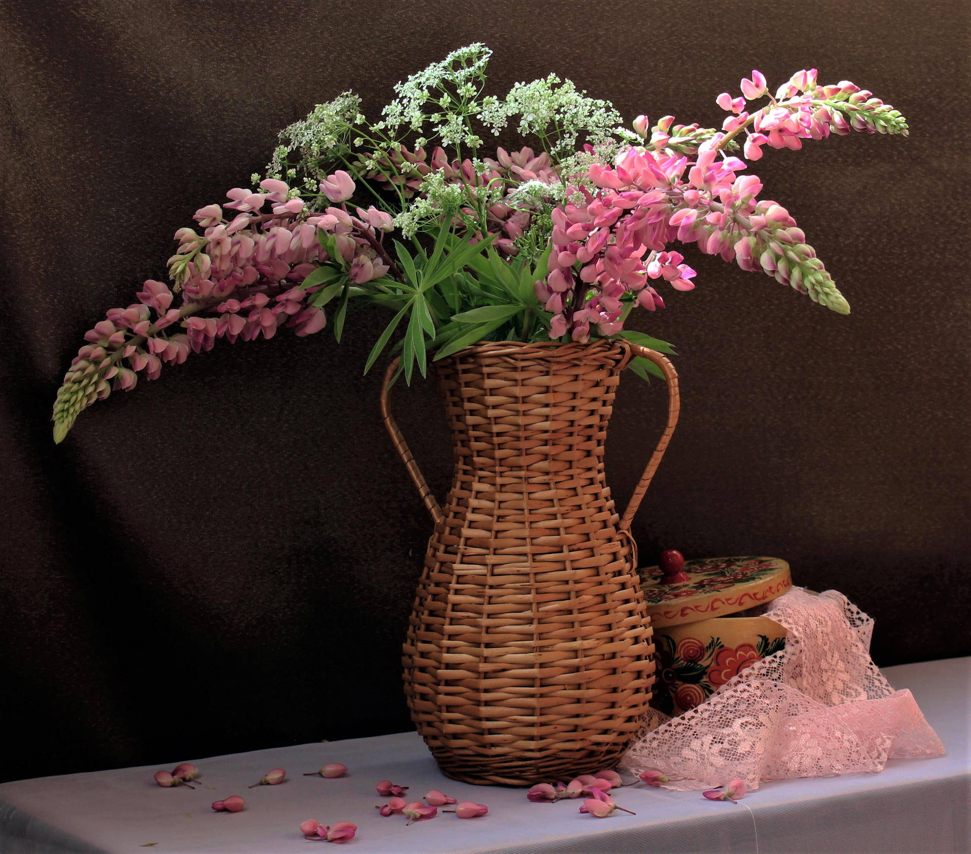 Pink Lupines In Woven Flower Vase Wallpaper