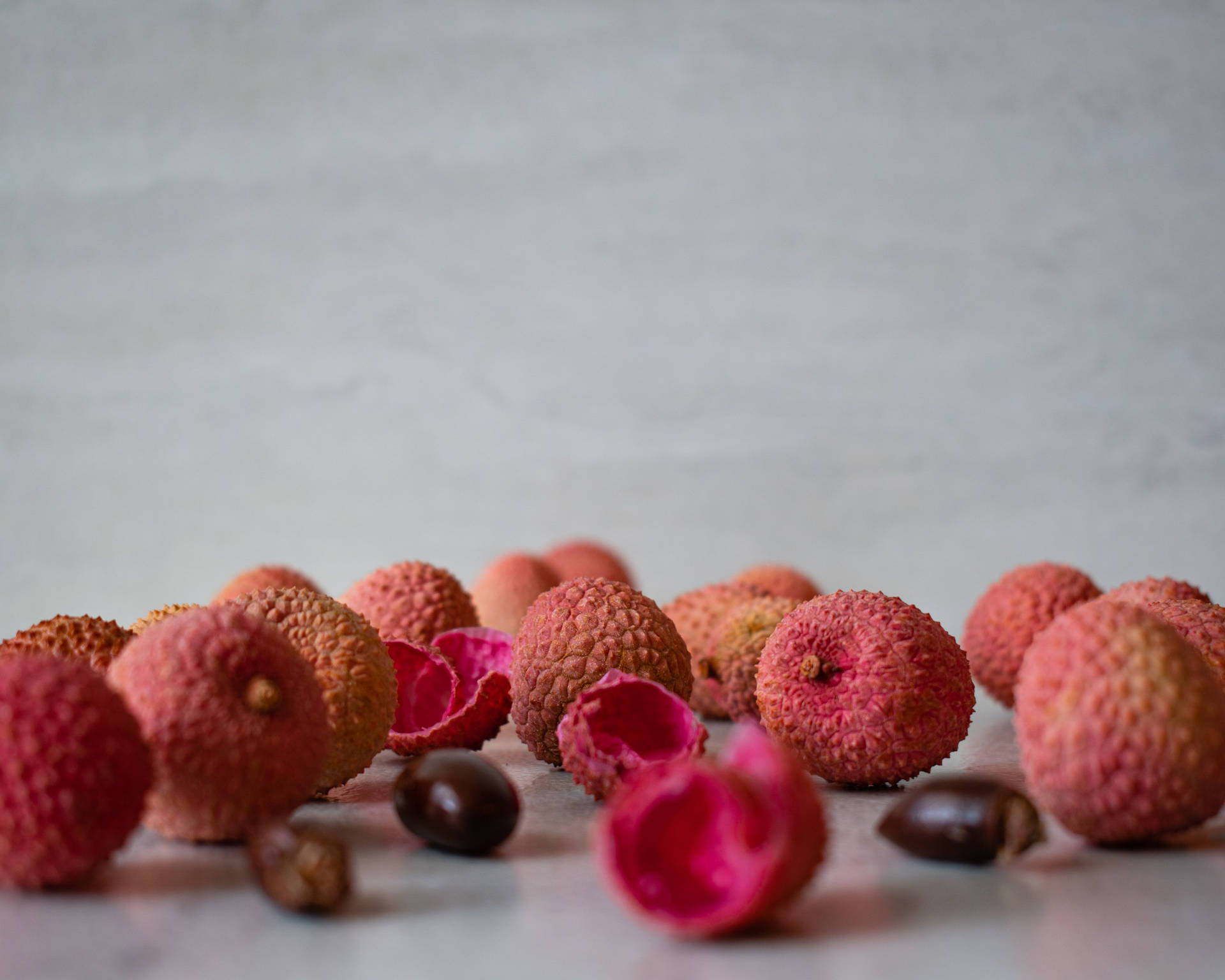 Pink Lychee Fruits Peelings And Seeds Wallpaper