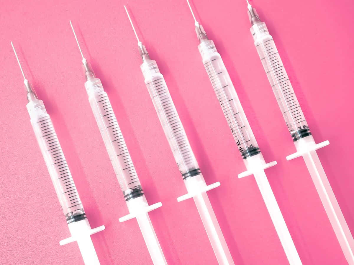 Pink Medical Syringes Aesthetic Wallpaper