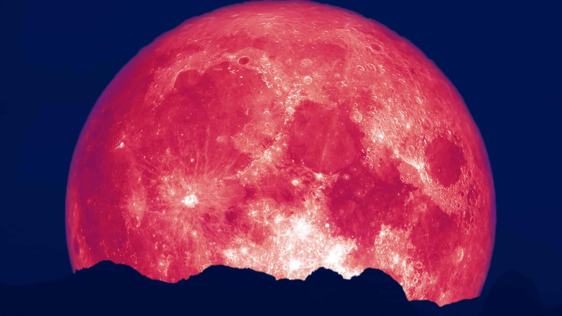 A romantic pink moon in the night sky