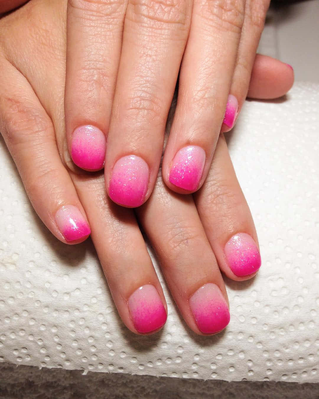 Beautiful Pink Nails at a Salon Wallpaper