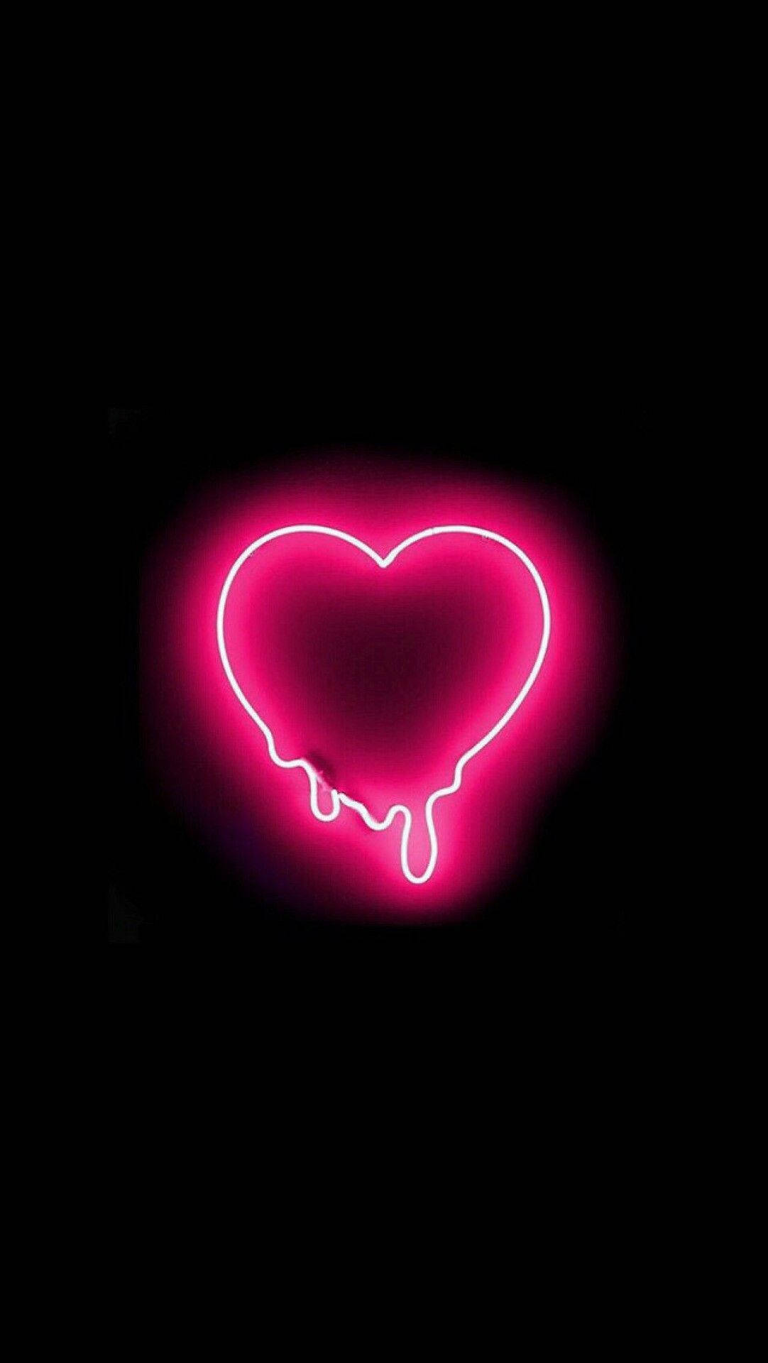 En pink neon hjerte med løbende blod på det. Wallpaper