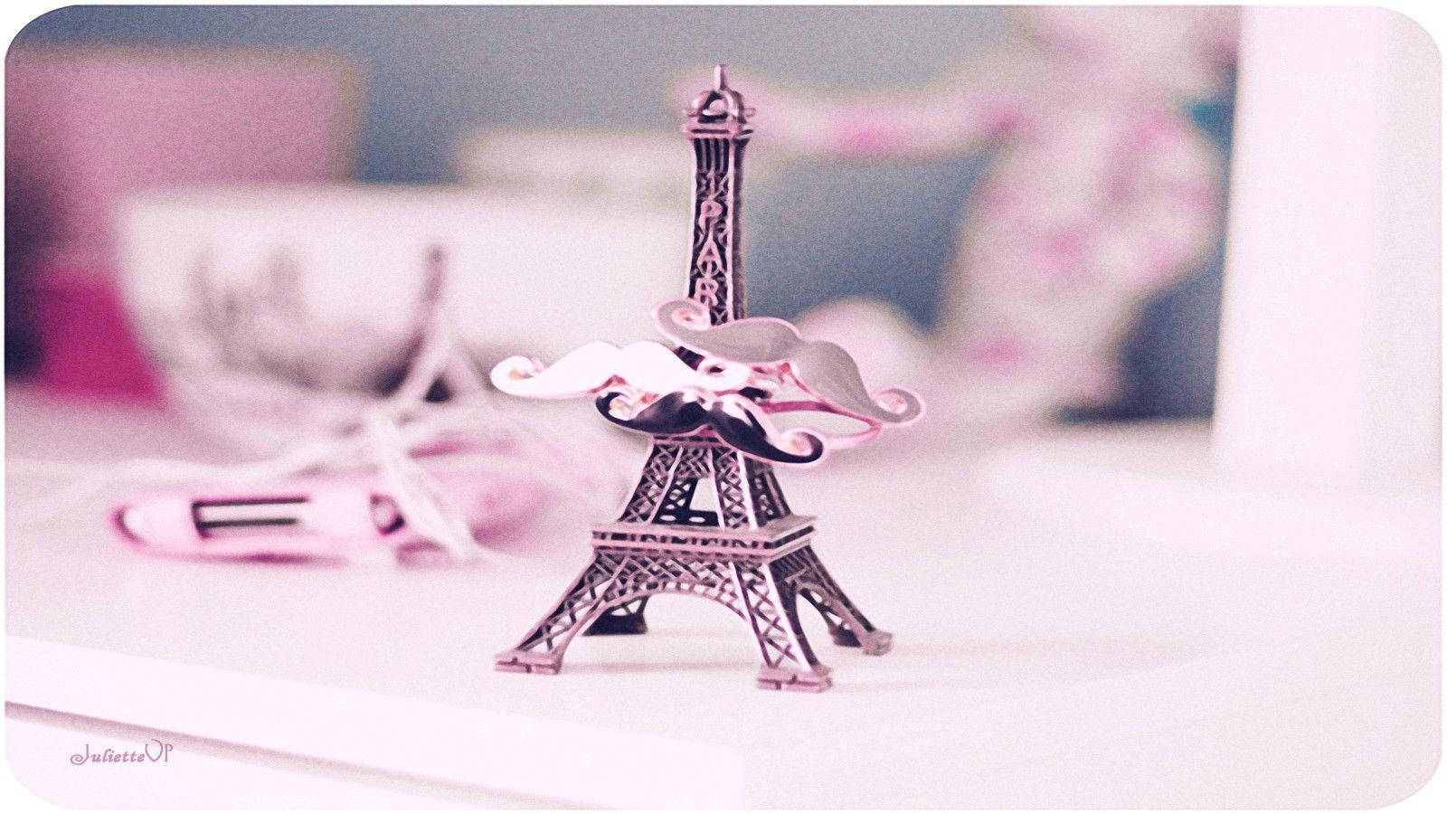 Pink Paris Eiffel Tower Ornament On Desk Wallpaper