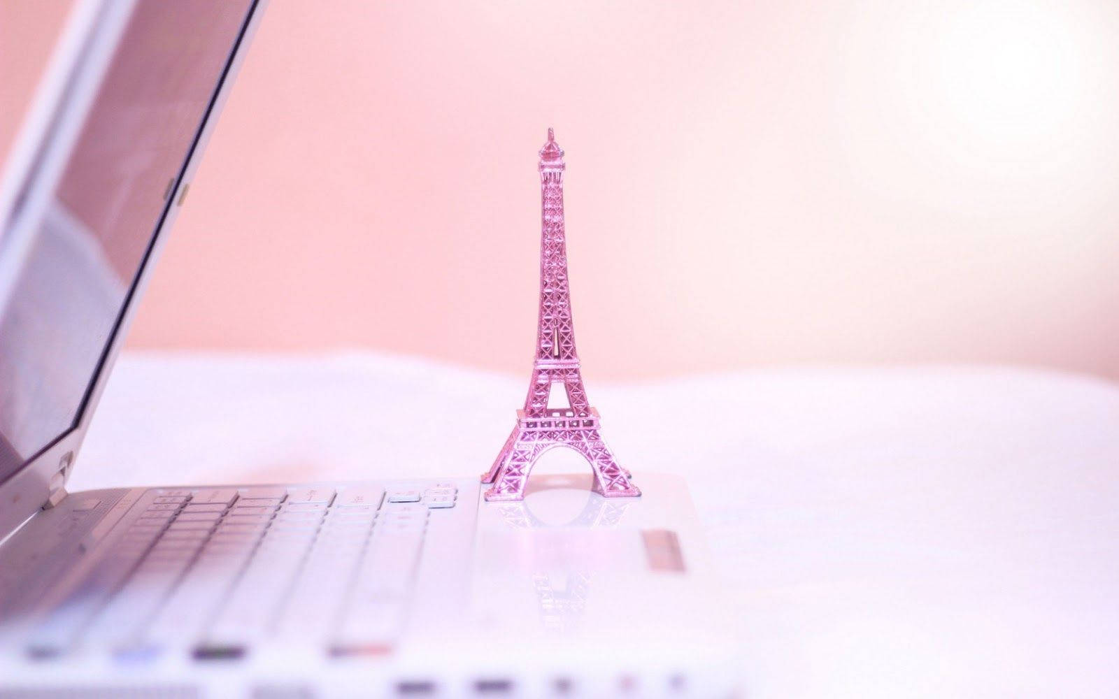 Pink Paris Tower Next To Laptop Wallpaper