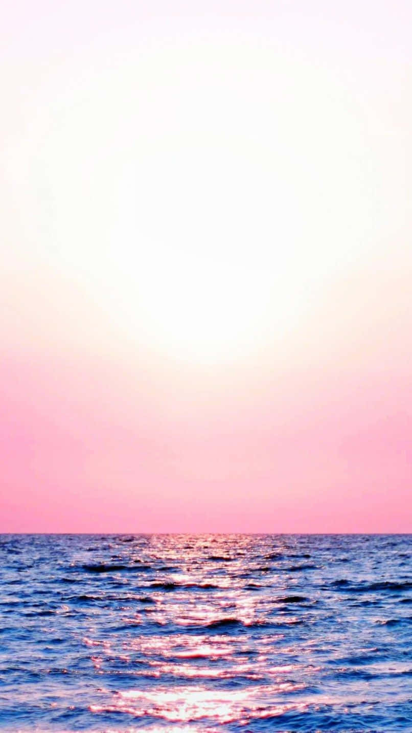 A Pink Sunset Over The Ocean
