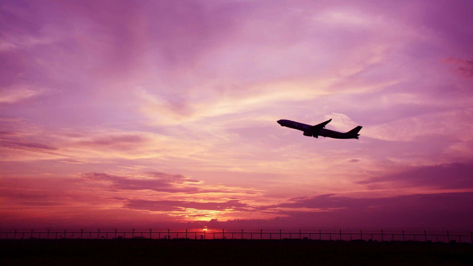 Atemberaubendesrosa Flugzeug Gleitet Durch Den Himmel Wallpaper