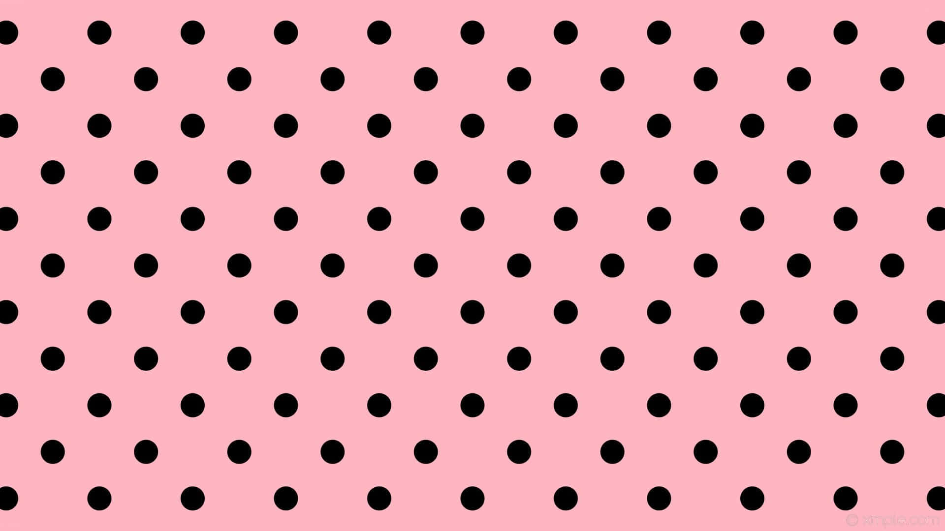 A fun and whimsical pink polka dot pattern.