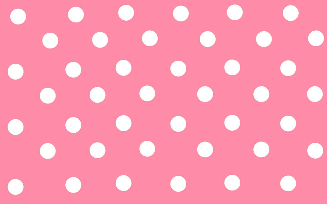 A Pink Polka Dot Pattern With White Dots
