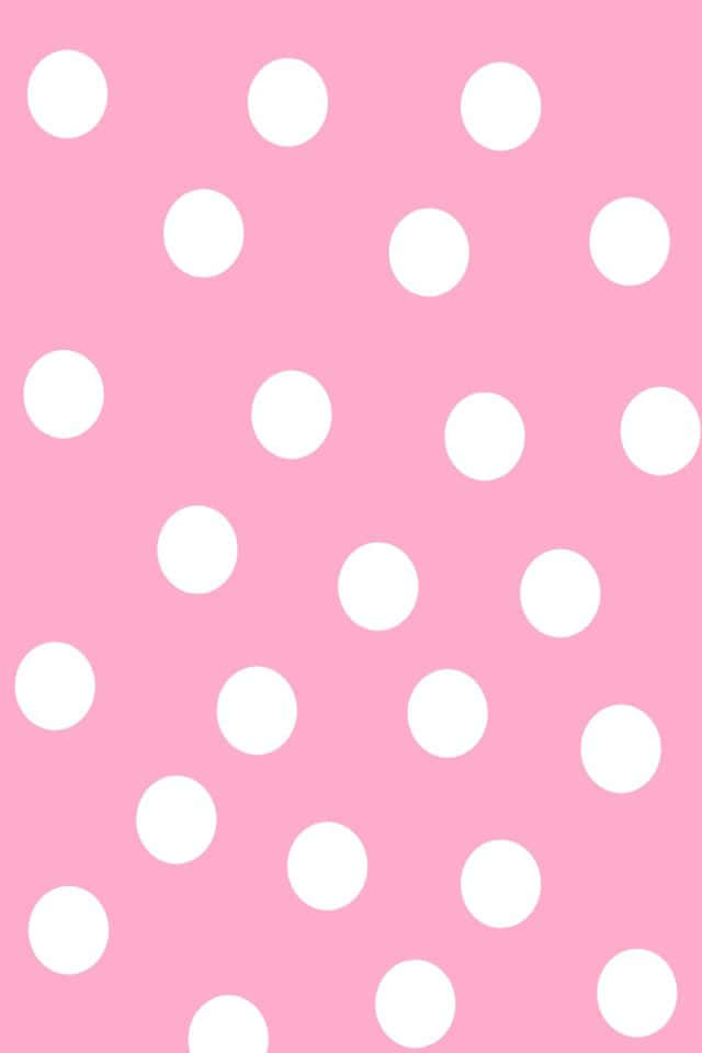 Brighten up your day with this cheerful pink polka dot background!