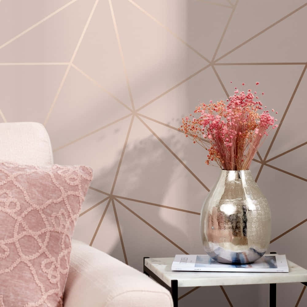A Pink Couch And Pink Pillows Are In Front Of A Geometric Wallpaper Wallpaper
