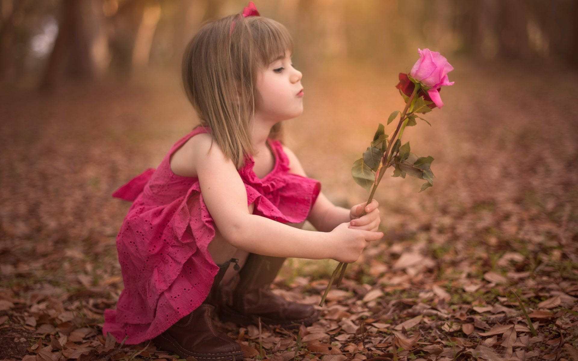 Pink Roses Held By A Little Girl Wallpaper
