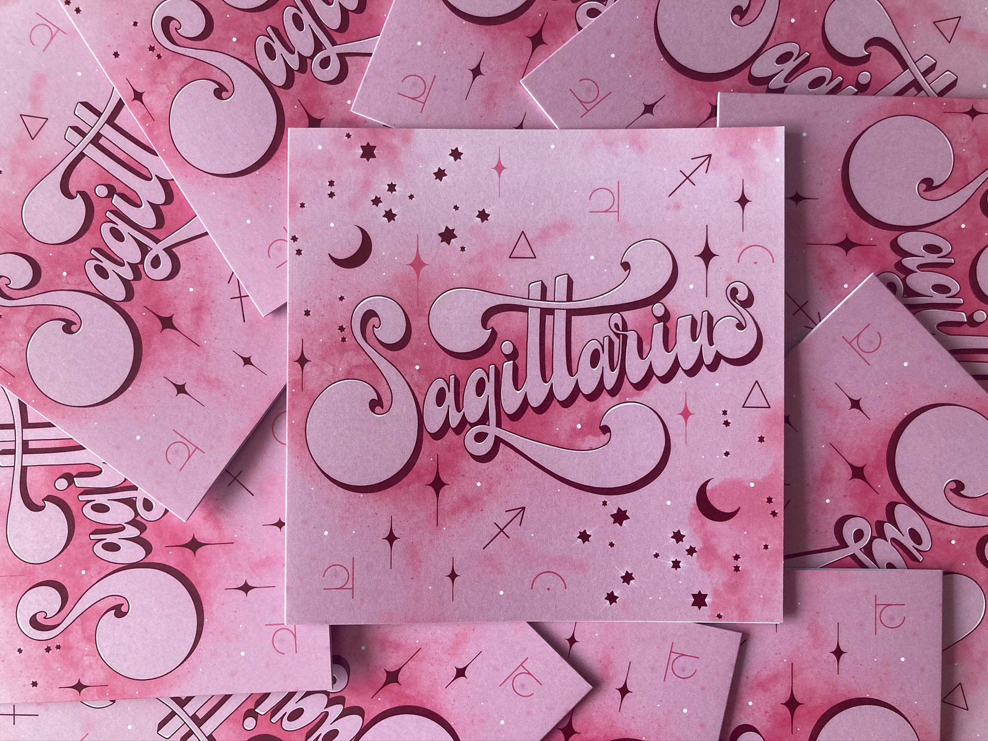 Caption: Majestic Pink Sagittarius Zodiac Card Wallpaper