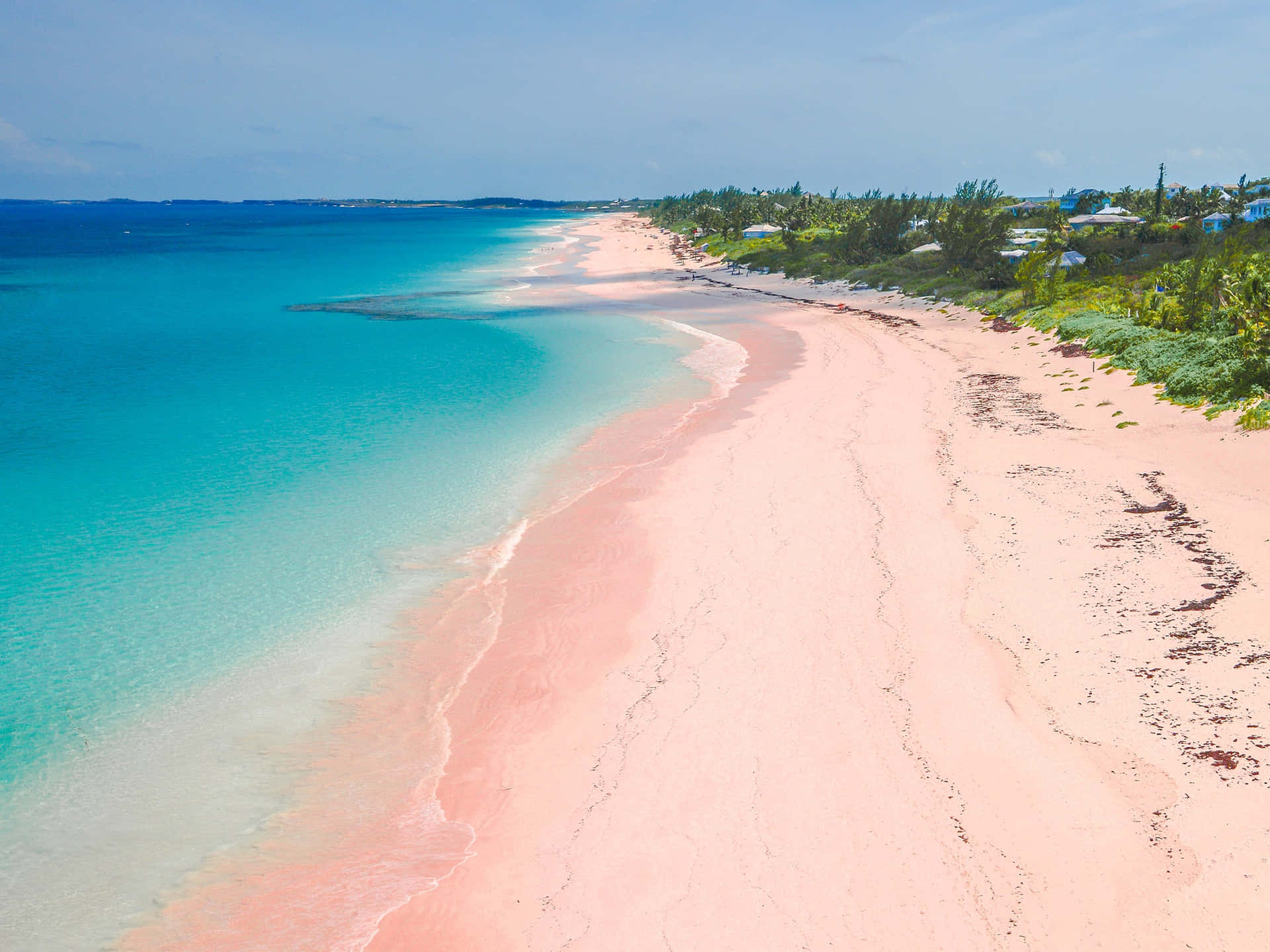 A breathtaking view of the unique Pink Sand Beach Wallpaper