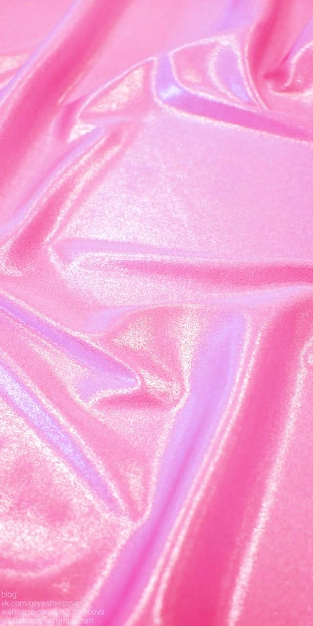 A Close Up Of A Pink Shiny Fabric Wallpaper