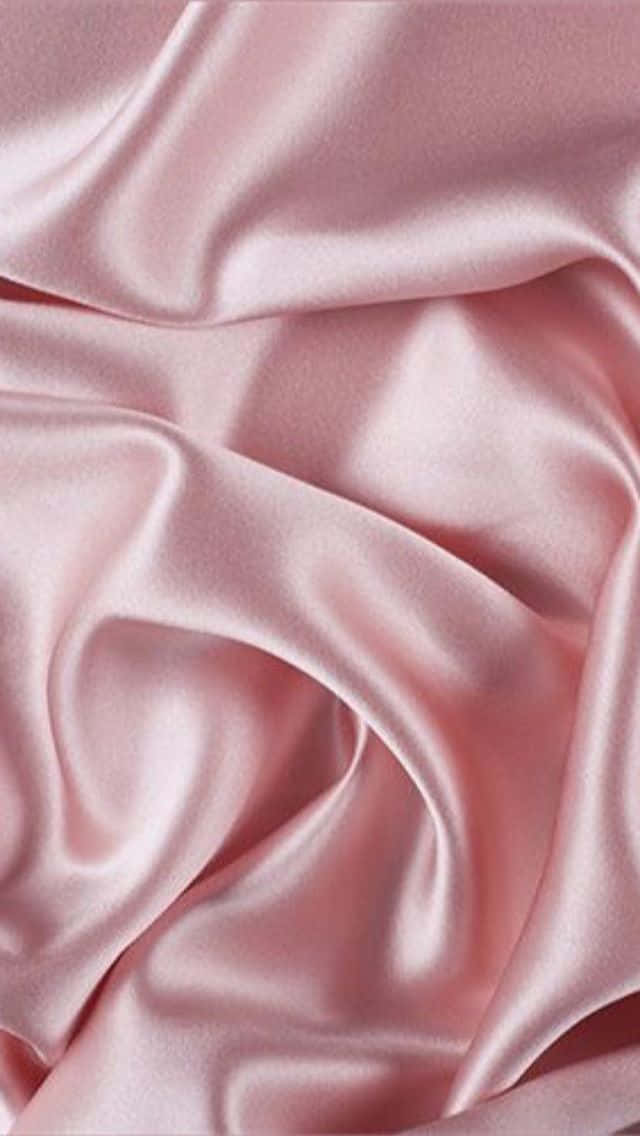 A Pink Satin Fabric With A Smooth Texture Wallpaper