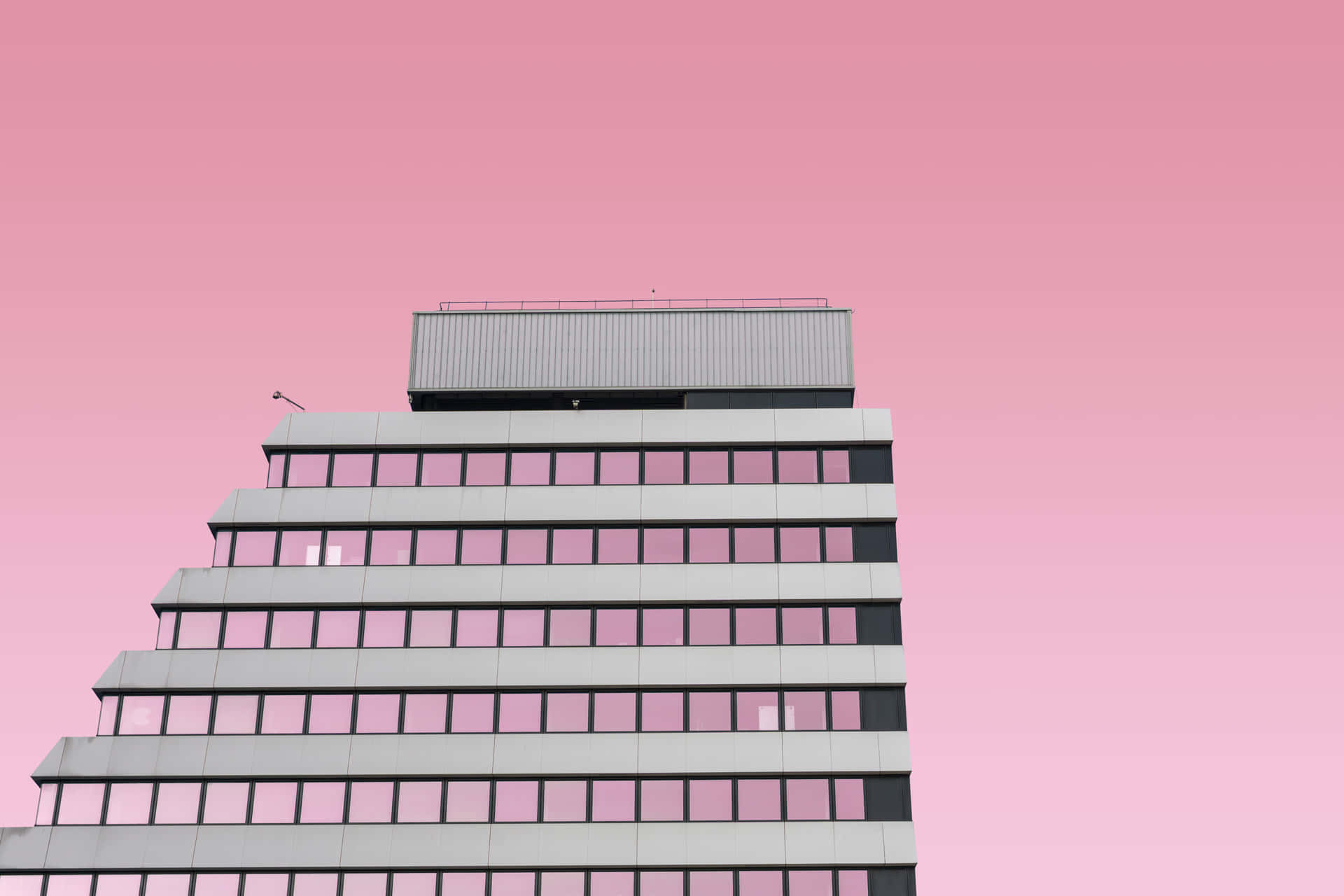 A Pink Sky With A Building