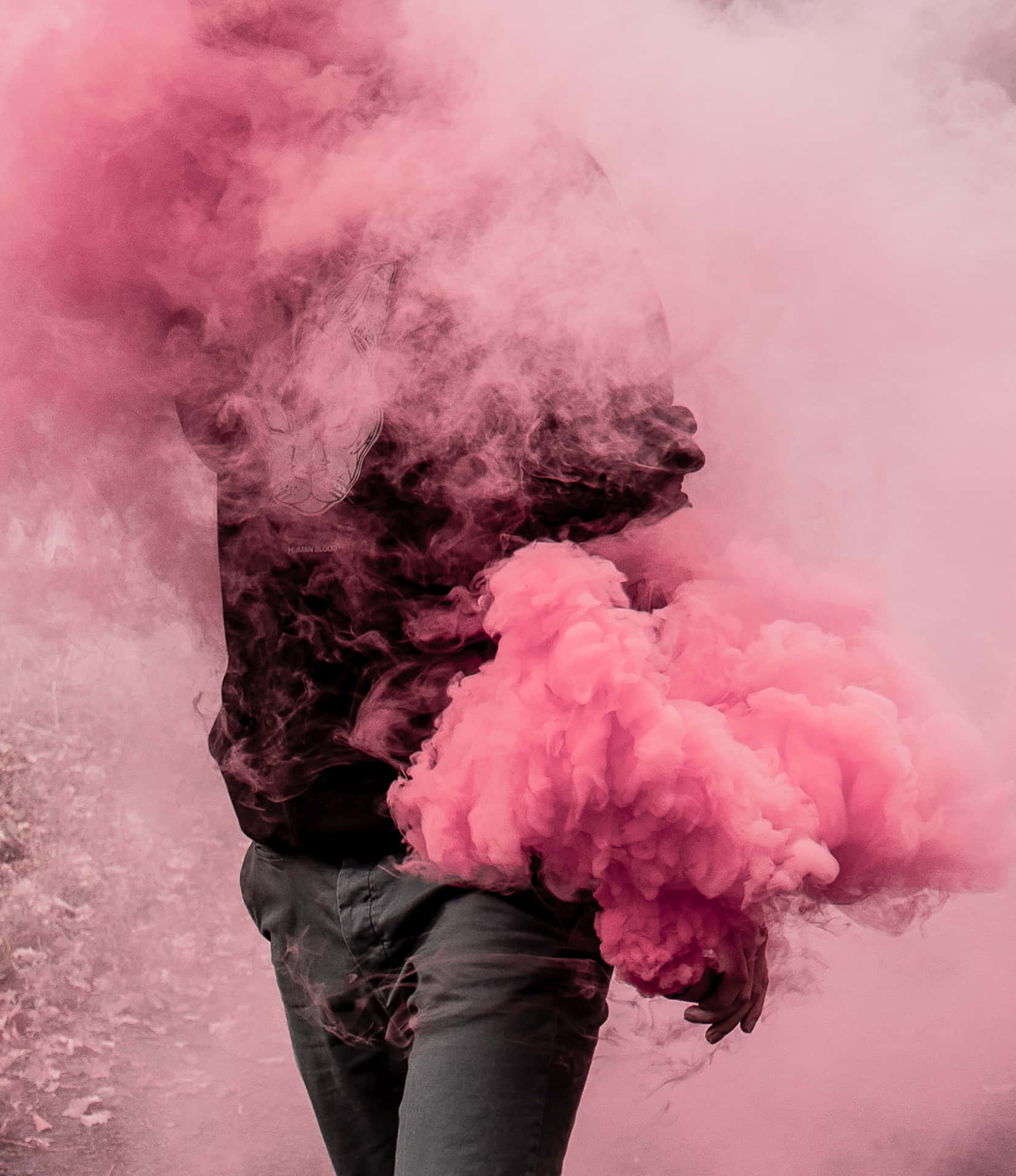 A Man Is Holding Pink Smoke