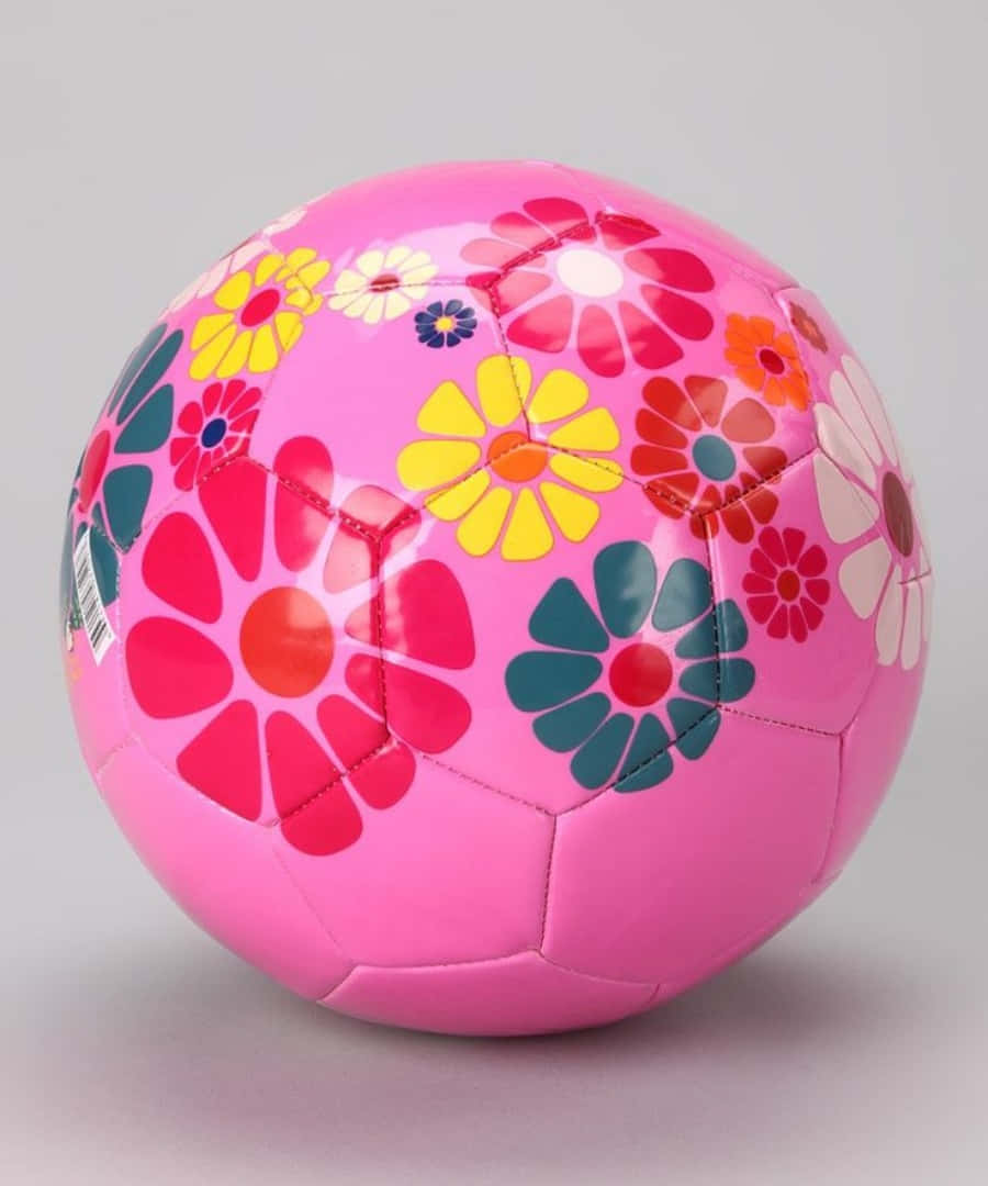 Caption: Play in Style with a Pink Soccer Ball! Wallpaper