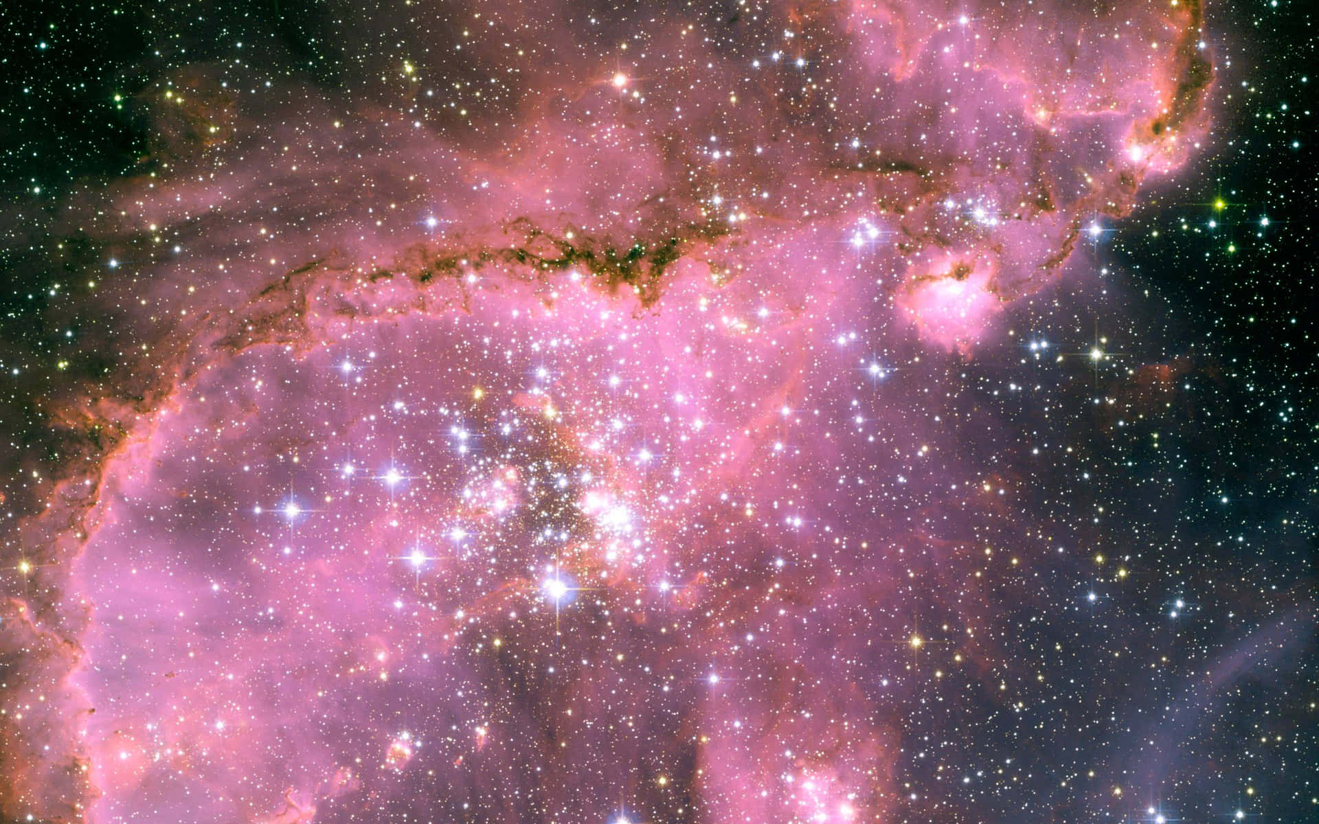 The Nebula Is Pink And Has Stars In It Wallpaper