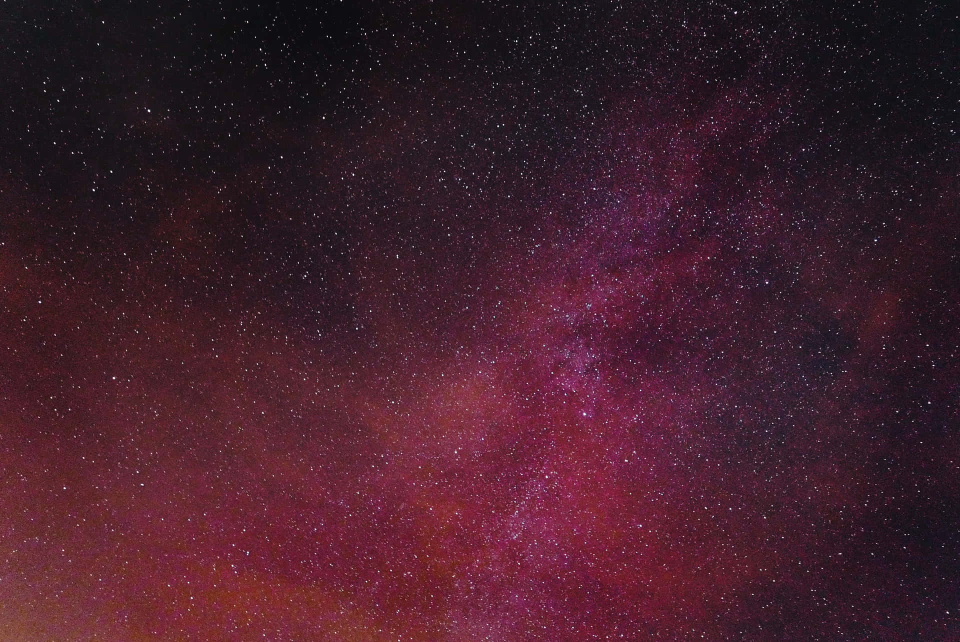Explore the cosmic splendor of the universe with Pink Space wallpaper Wallpaper