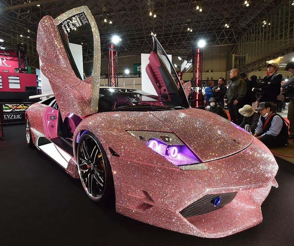 Pink Sparkling Lamborghini With Doors Open Wallpaper