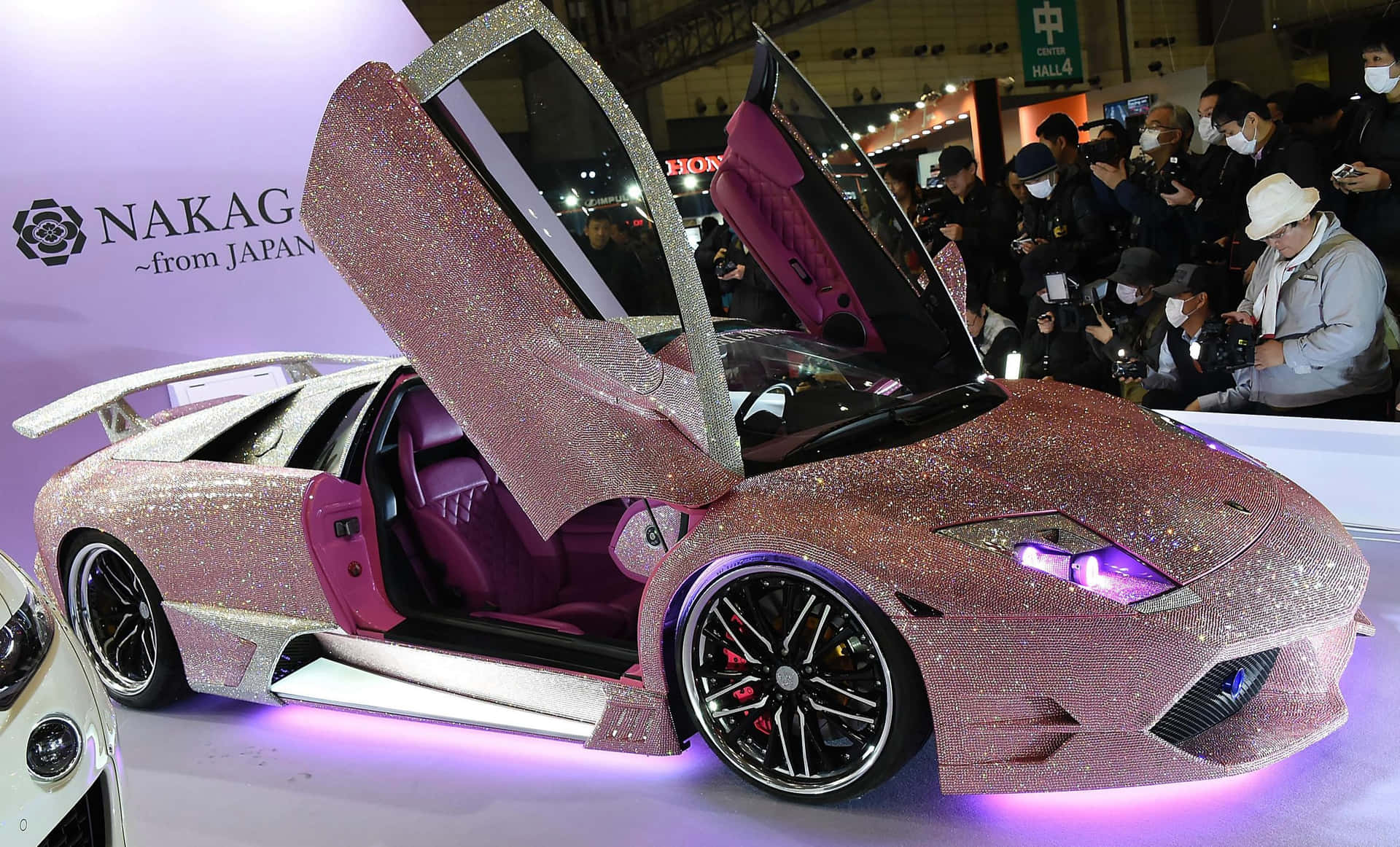 Pink Sparkling Lamborghini With Doors Open Wallpaper