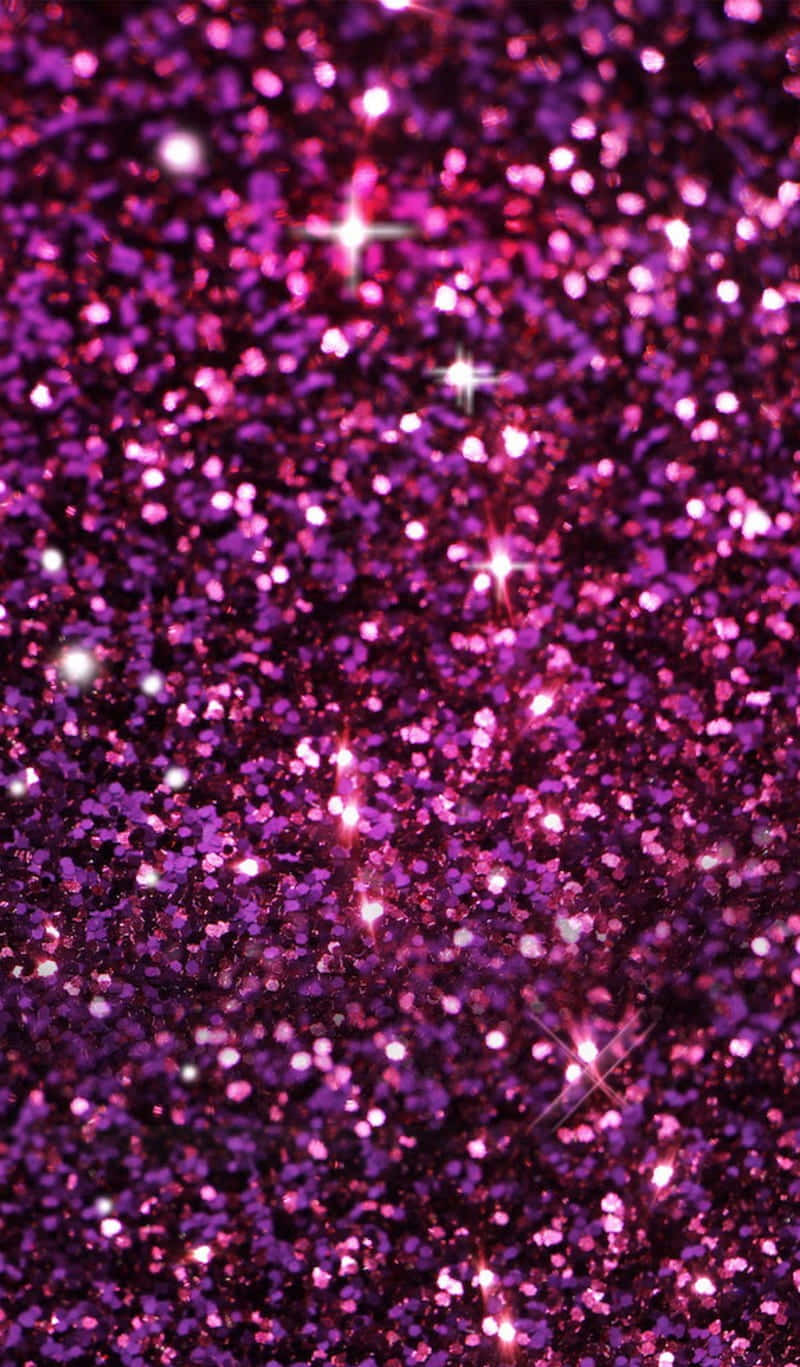 A Purple Glitter Background With Stars