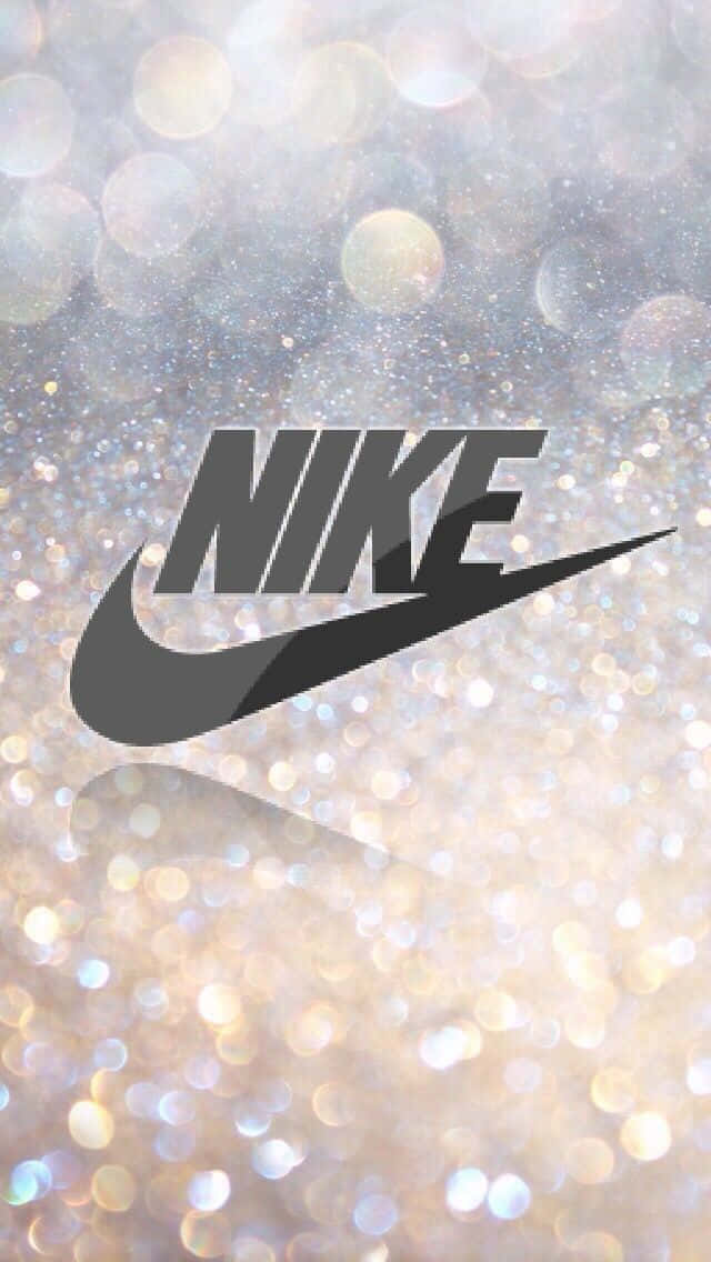 Logotipode Nike Sobre Un Fondo Brillante Con Purpurina Fondo de pantalla