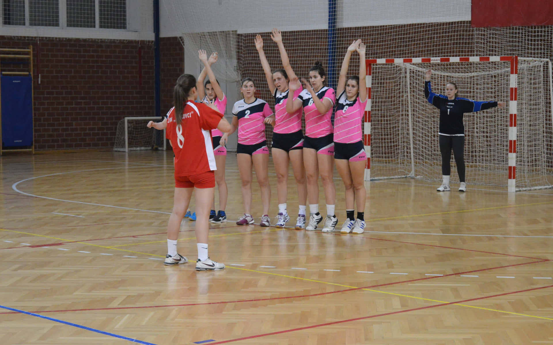 Einegruppe Von Mädchen Spielt Volleyball. Wallpaper