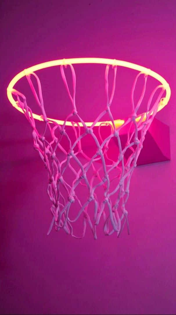 En basketball kurv med et pink lys på det. Wallpaper