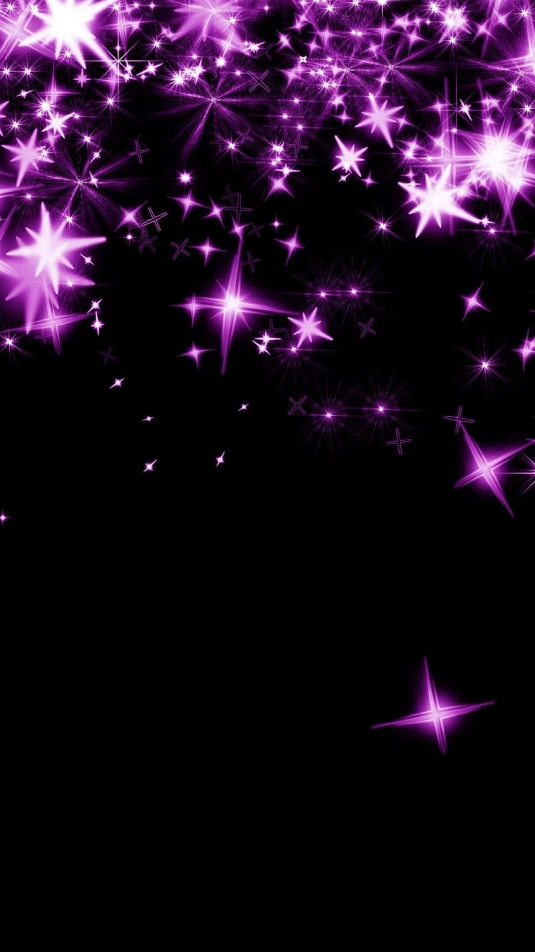 A mesmerizing pink galaxy with glowing stars Wallpaper