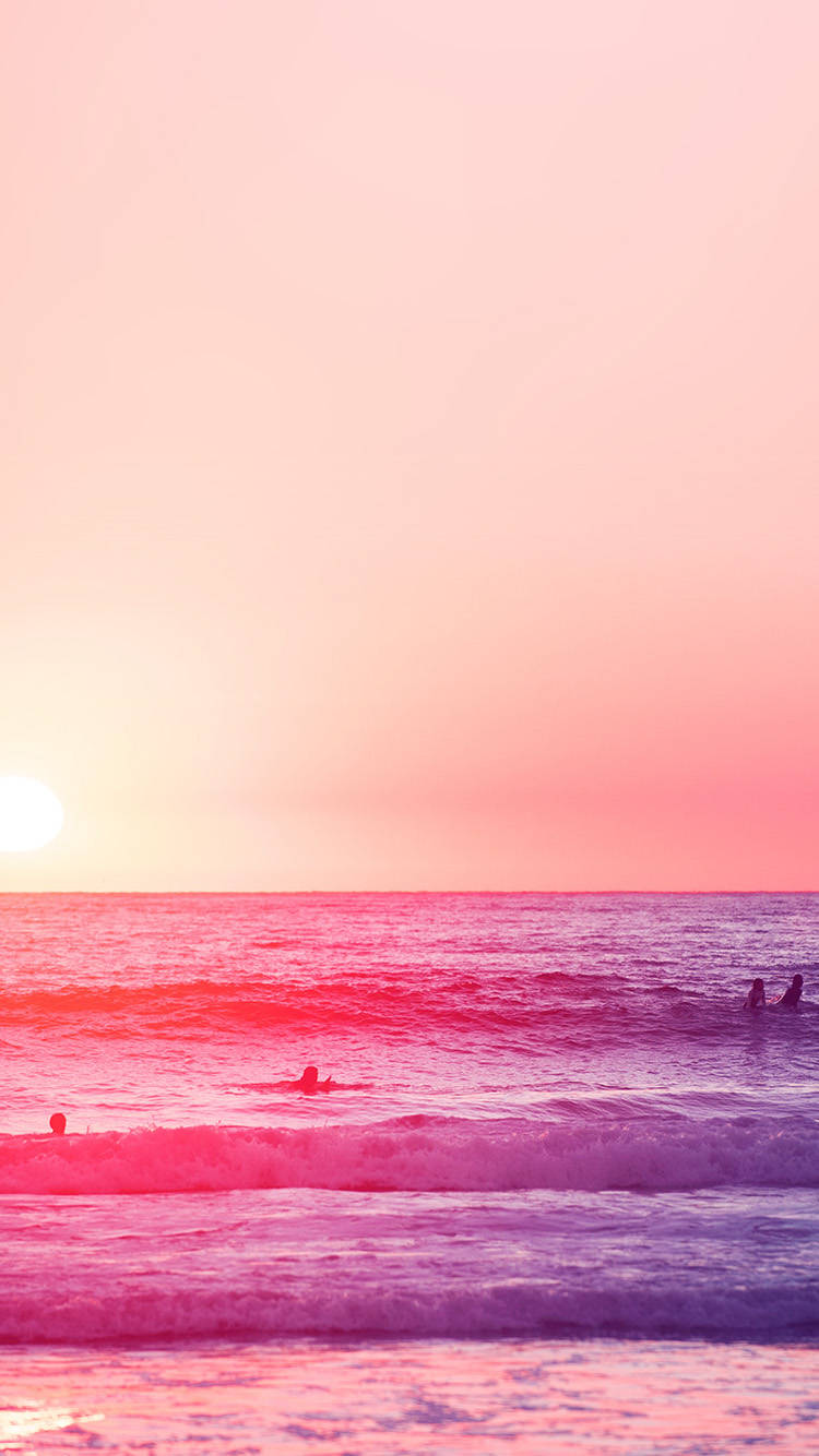 A Group Of People Are Surfing In The Ocean Wallpaper