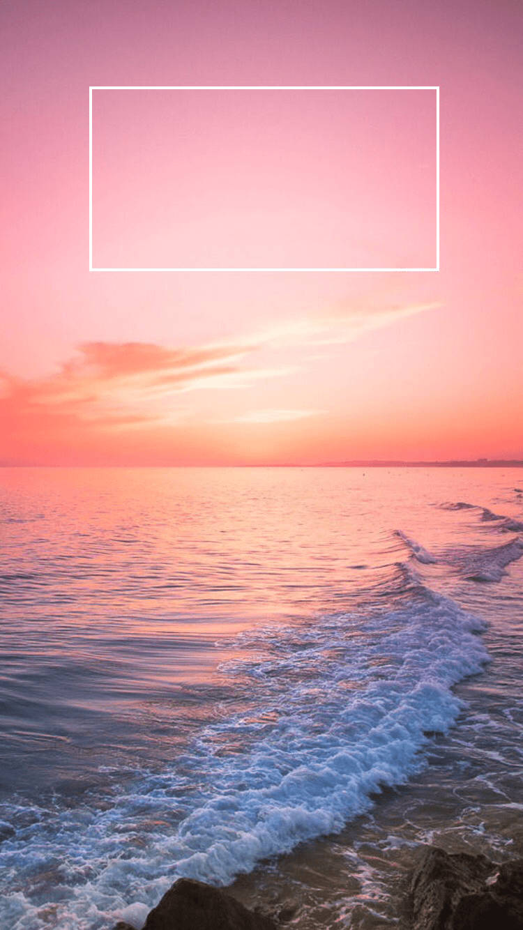 Capture The Mesmerizing Colors Of The Pink Sunset On Your Iphone Wallpaper