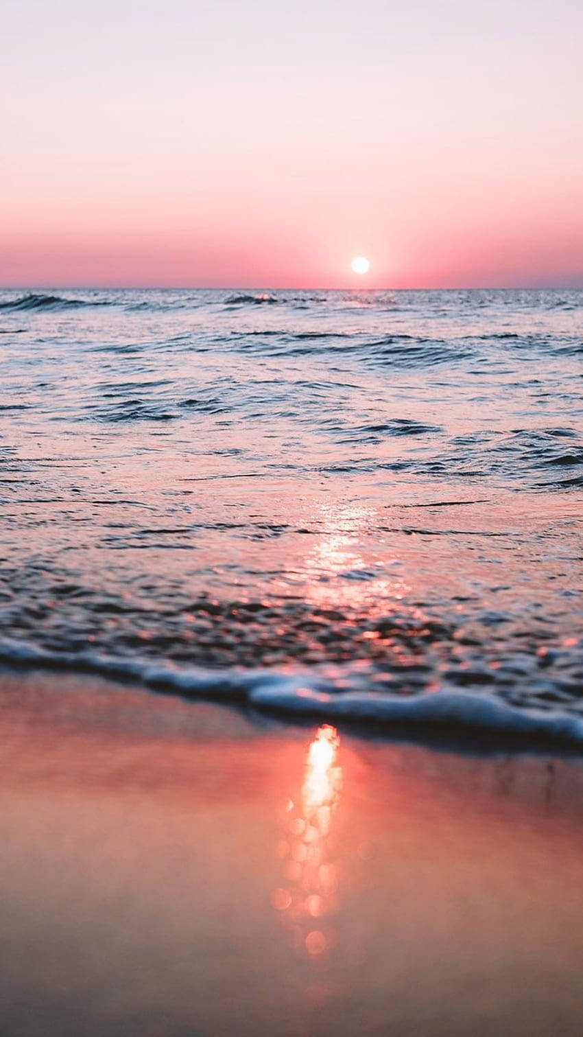 Capturing the beauty of a pink sunset on an iPhone. Wallpaper