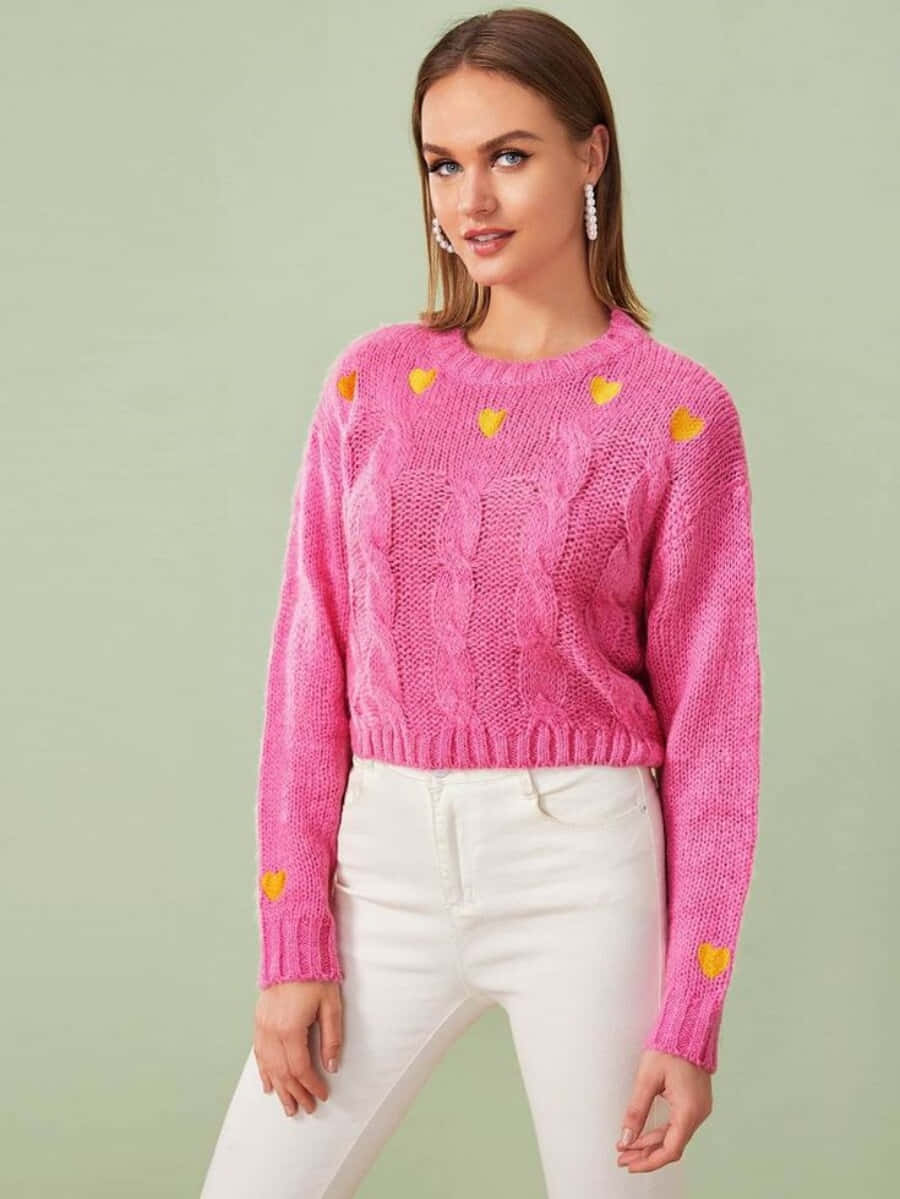 Woman wearing a cozy pink sweater Wallpaper